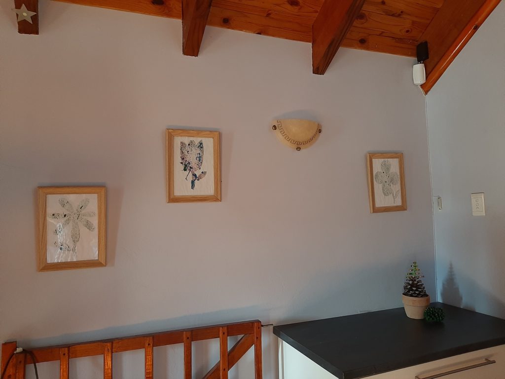 wall art with child's paintings framed