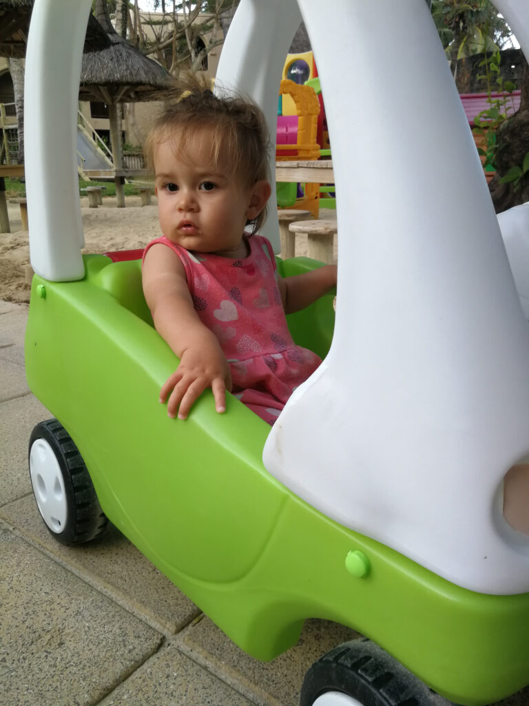 toddler in plastic car Mauritius