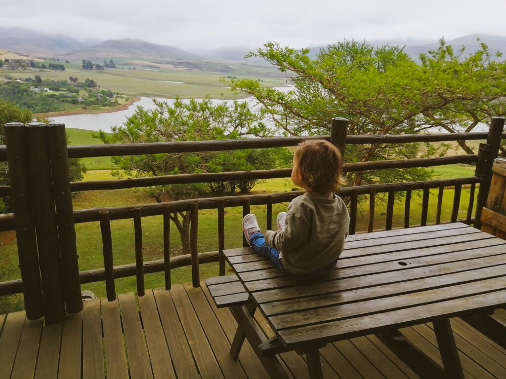 Drakensberg, child on table, view of lake