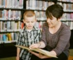 7-8 year old reading in a library