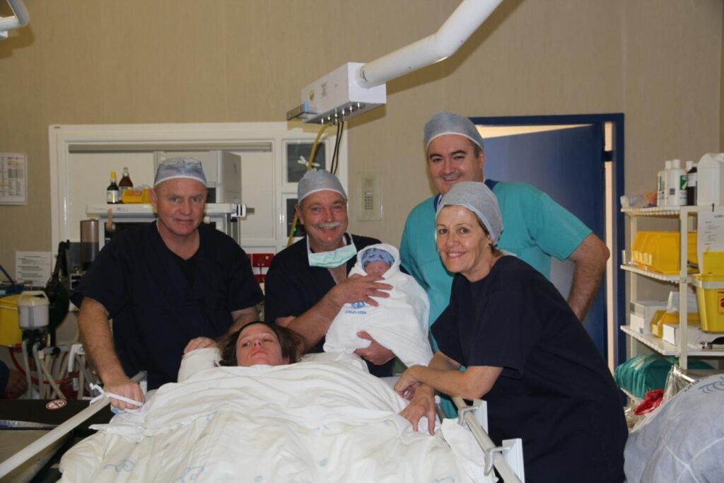 The birth of my son and the doctors that made it happen. The midwife is also pictured. Health plans for pregnancy