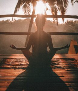 mediation. woman meditating in the sun
