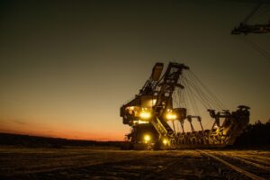 Mining machinery against a sunset