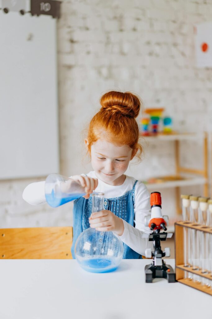 Girl doing a science experiment, science extra murals