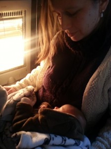 newborn baby next to the heater