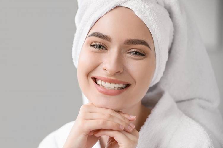 A woman with a towel on her head