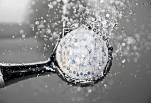 A shower head with drops of water