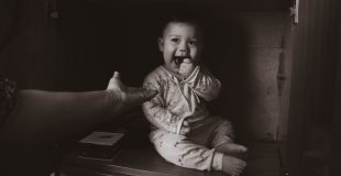 Baby eating something it shouldn't. Keep adult products safely away from children.