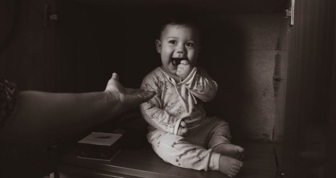 Baby eating something it shouldn't. Keep adult products safely away from children.