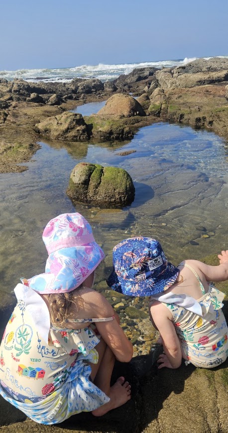 Children at a rock pond at the Wild Coast